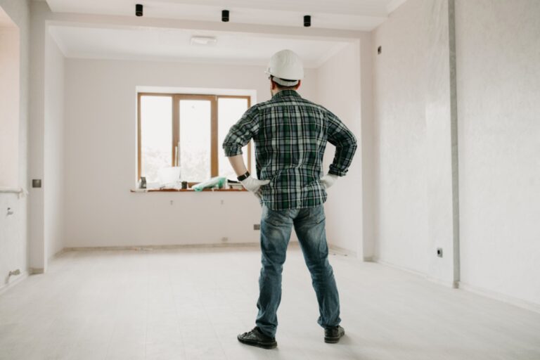 man standing in a new house