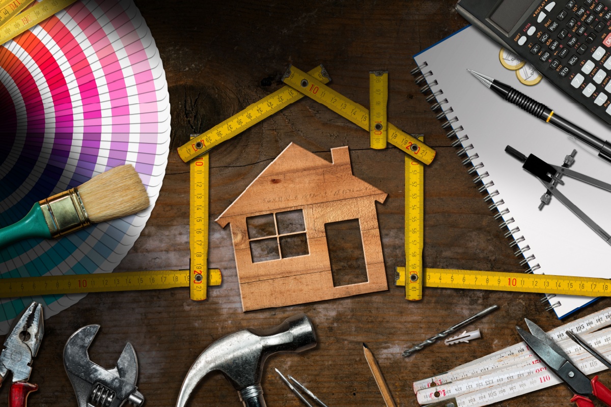 woman model house and home improvement tools