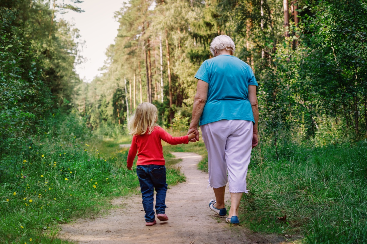 grandmother and granddaughter walking outdoors