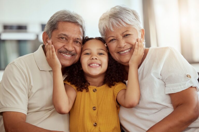 grandparents and grandchild similing