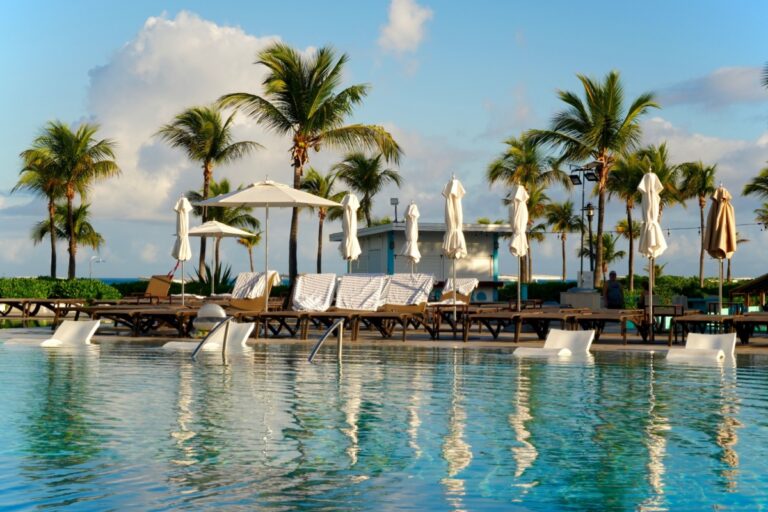 pool lounge chairs next to a pool