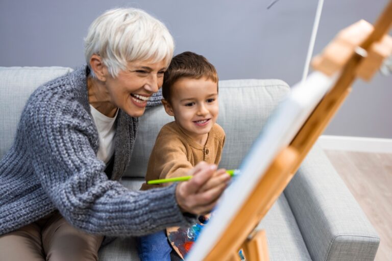 grandma and child paiting together