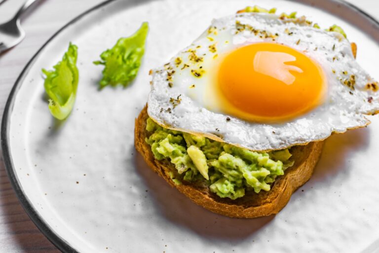 avocado toast with an egg fried on top