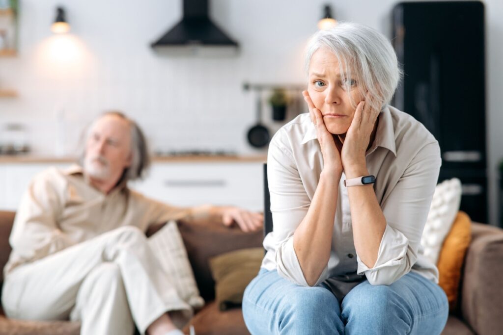 woman worried next to her husband