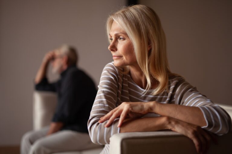 woman thinking next to her husband