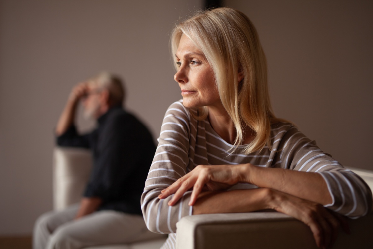 woman thinking next to her husband