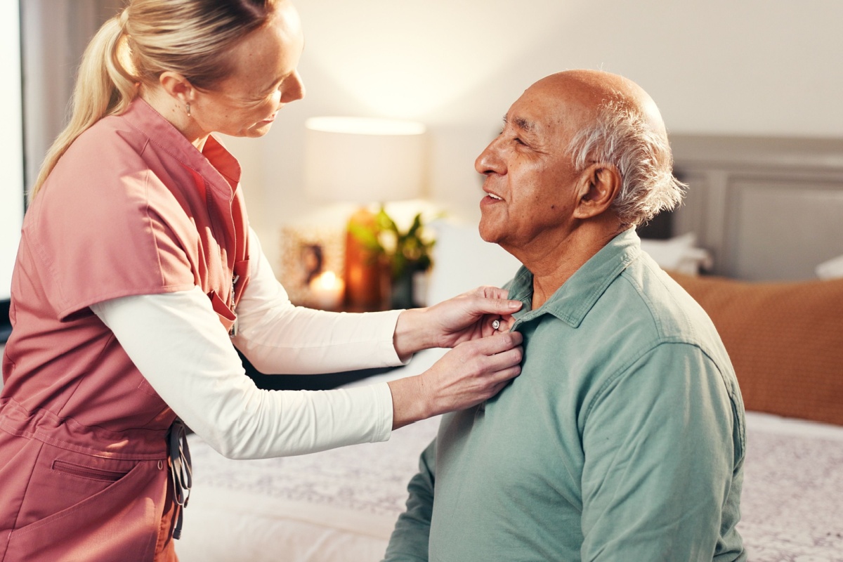 nurse taking care of an old man