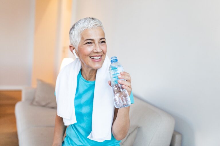 midlife woman drinking water
