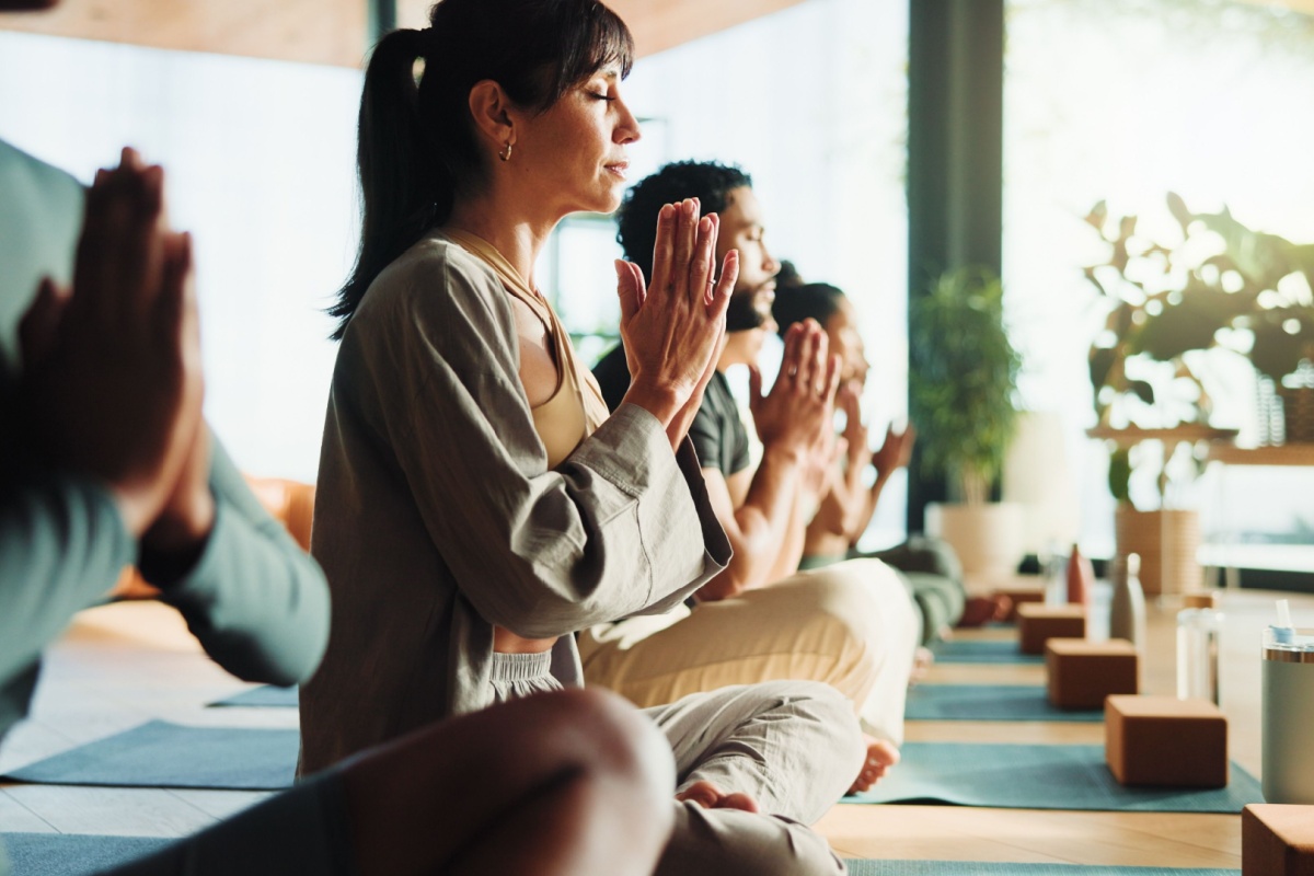 a group of people practicing yoga