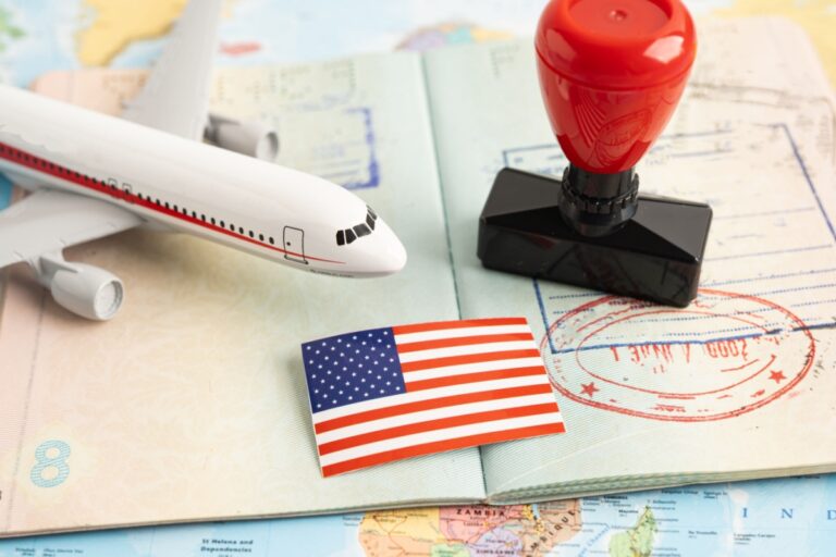 usa flag, stamp and small plane over a passport