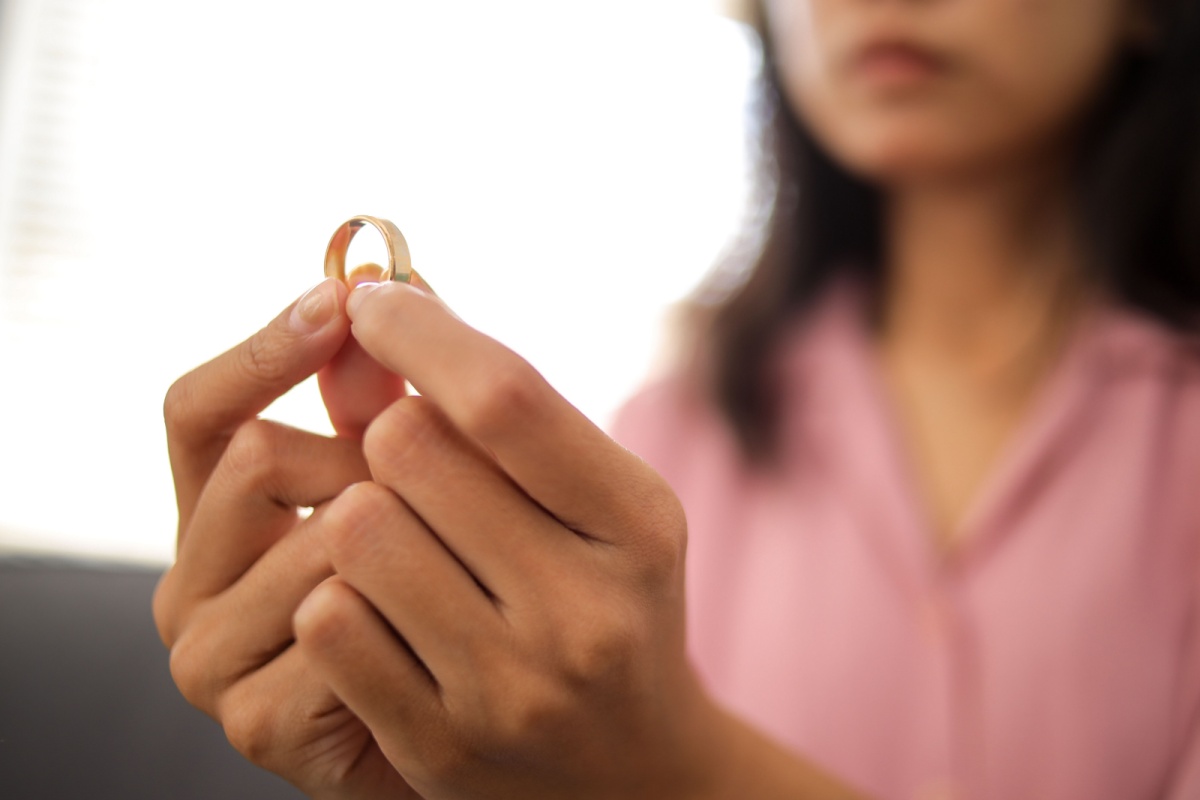 woman holding a wedding ring
