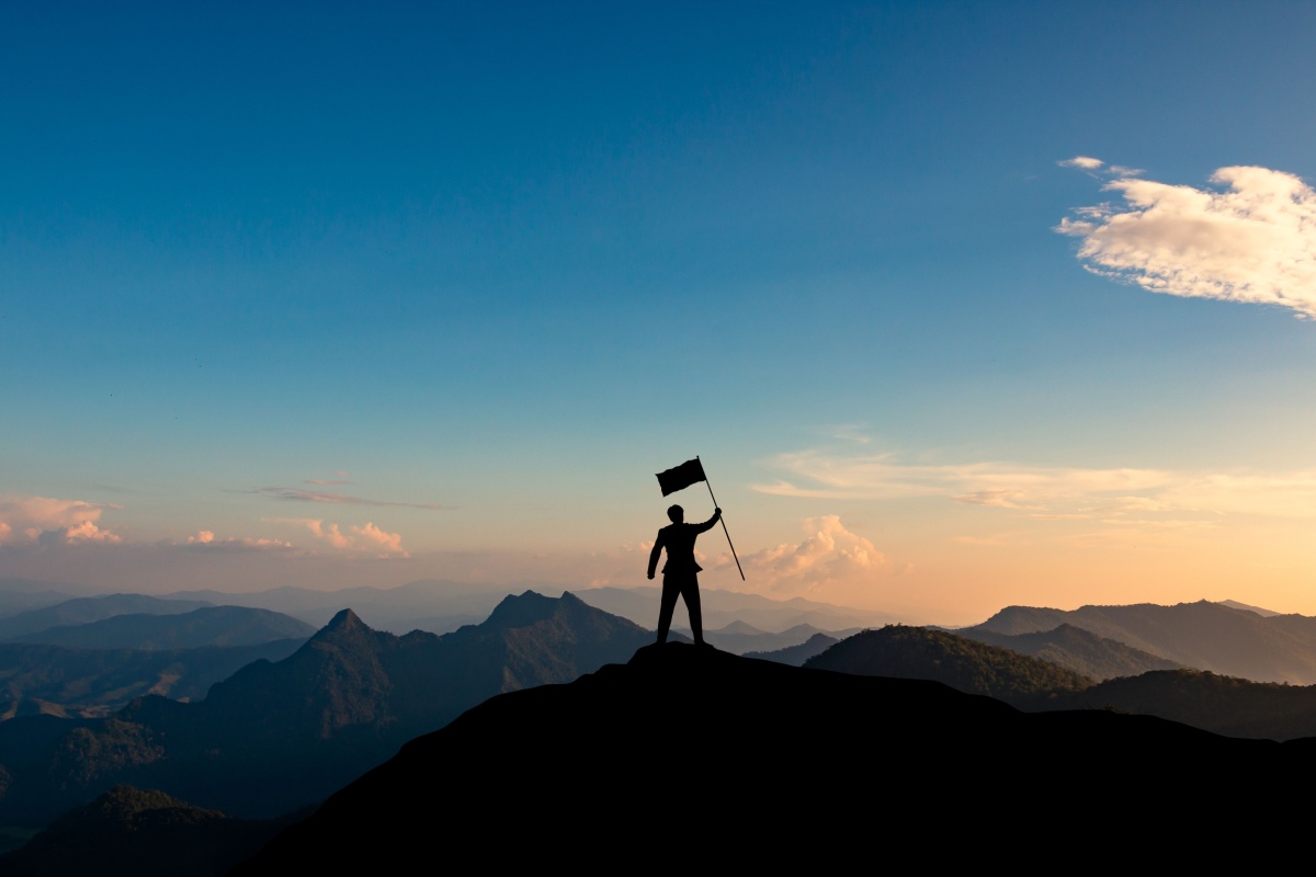 a man at a mountain peak
