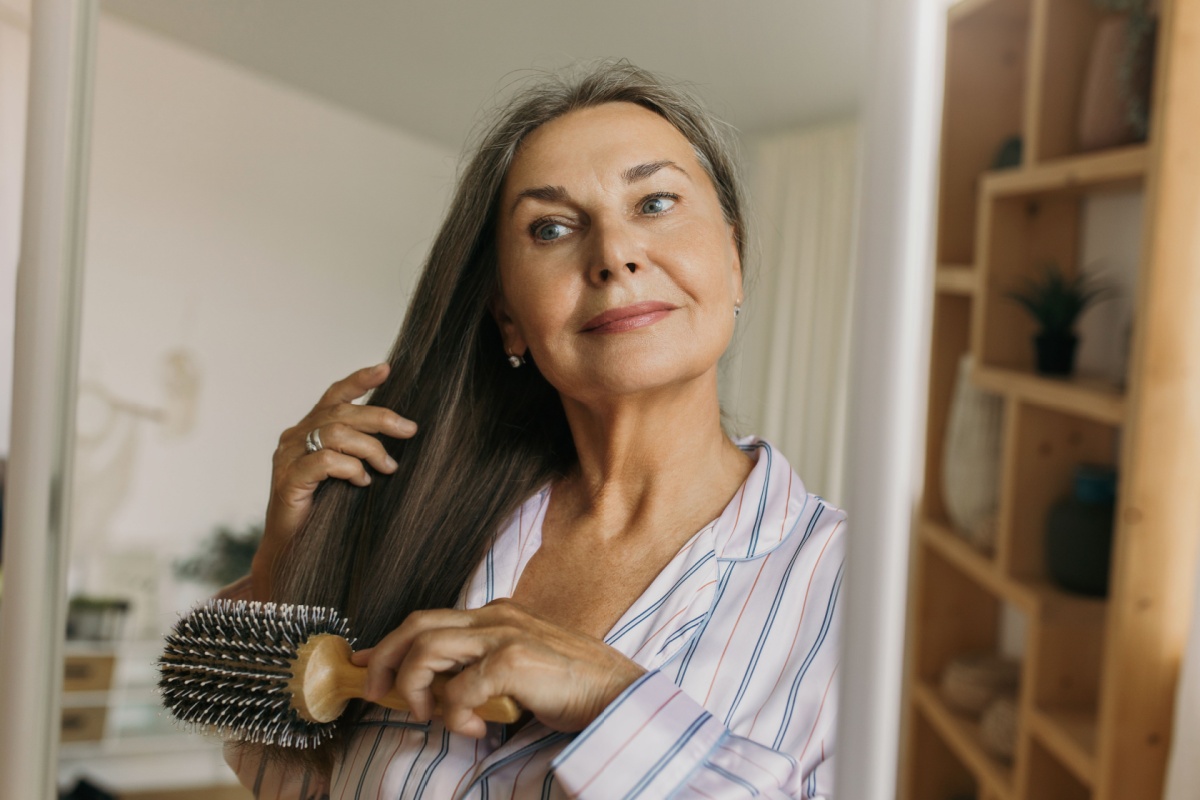 woman combing her hair