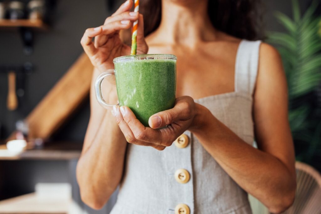 Woman with green juice