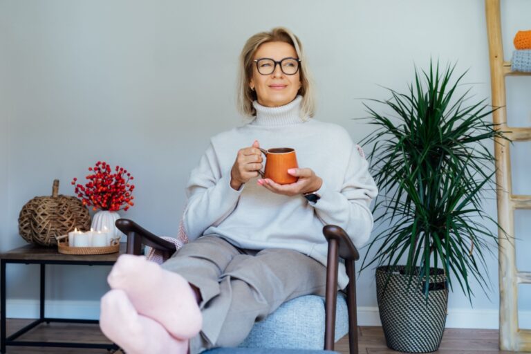middle aged woman with a cup in her hands