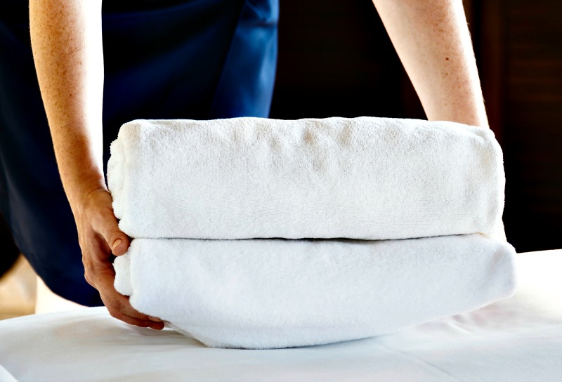 woman folding laundry