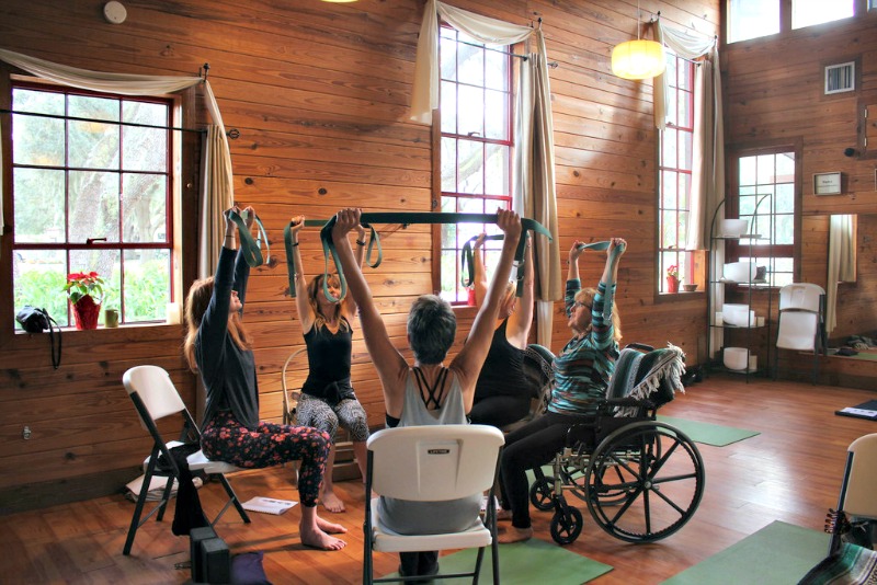 Taking chair yoga training at Heartwood
