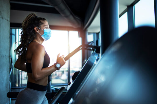 Woman at a gym wearing a mask