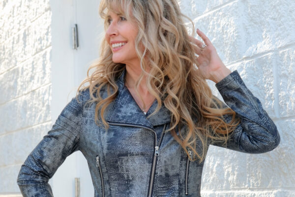 Slow, classic, comfortable and wrinkle-free style is embodied by this black jumpsuit and classic vegan leather jackets.